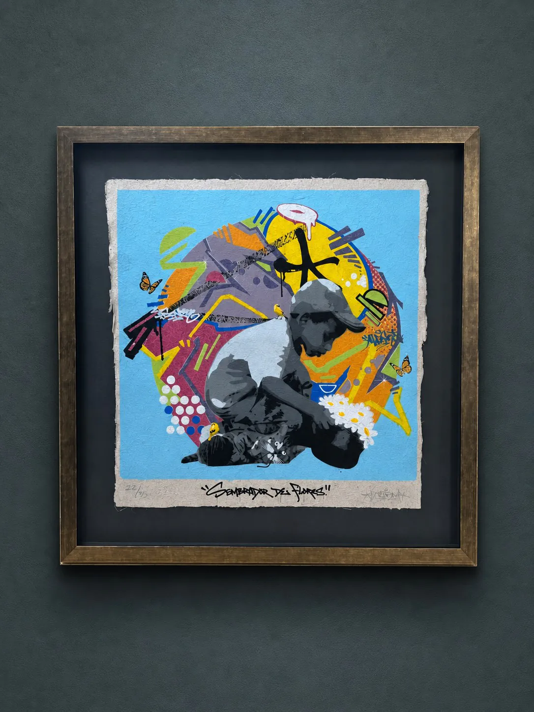 A colorful contemporary work float mounted in a dark frame